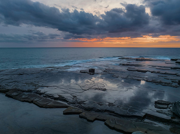Sunrise over the sea and rocky Inlet