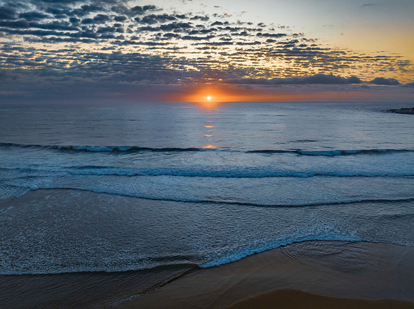 Beautiful sunrise with clouds over the ocean