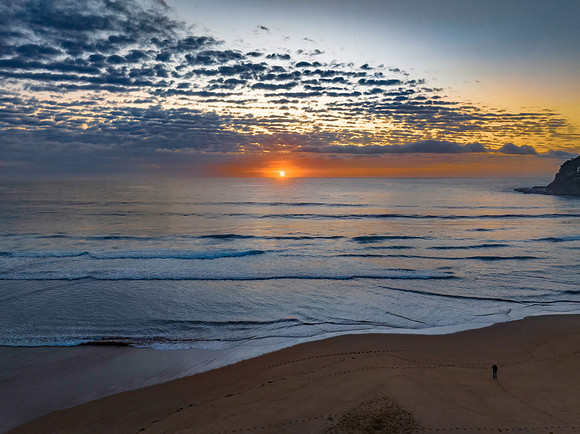 Beautiful sunrise with clouds over the ocean