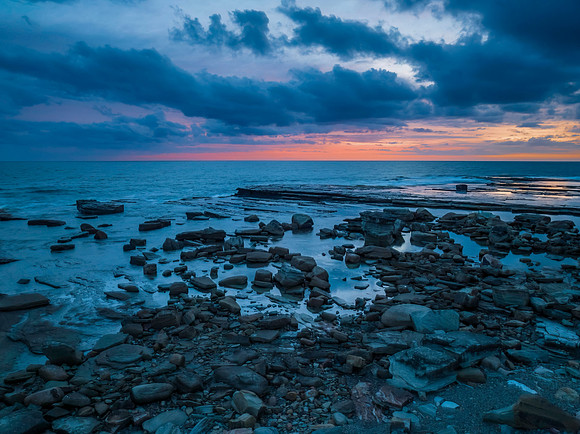 Sunrise over the sea and rocky Inlet