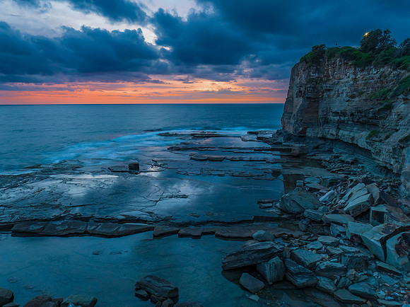 Sunrise over the sea and rocky Inlet