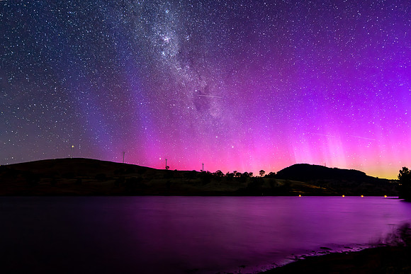 A Pink Aurora Australis and the Milky Way Shimmers Over the Dam