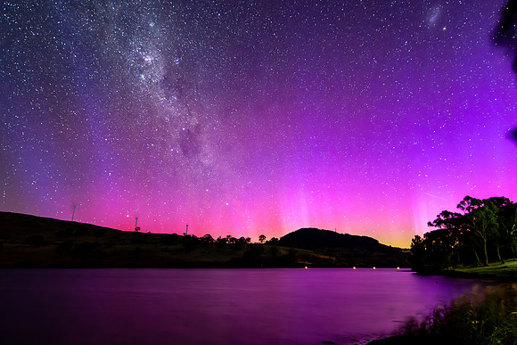 A Pink Aurora Australis and the Milky Way Shimmers Over the Dam