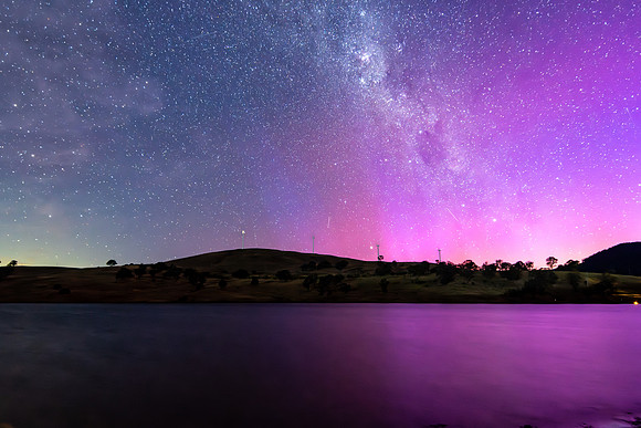 A Pink Aurora Australis and the Milky Way Shimmers Over the Dam