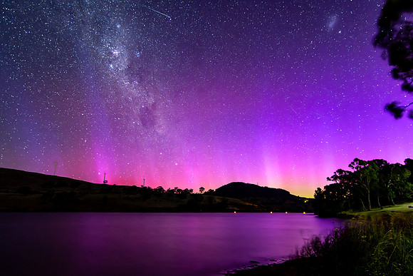 A Pink Aurora Australis and the Milky Way Shimmers Over the Dam