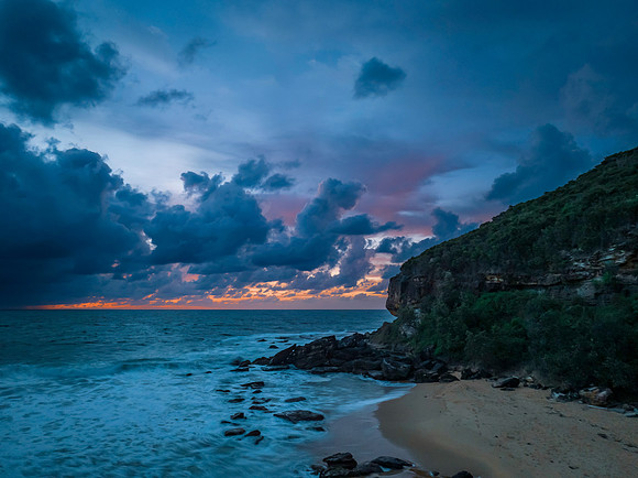 Rain clouds and sunrise at the beach