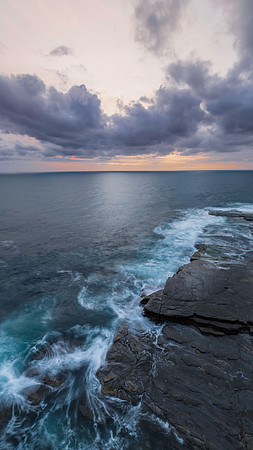 Sunrise over the sea and rocky Inlet