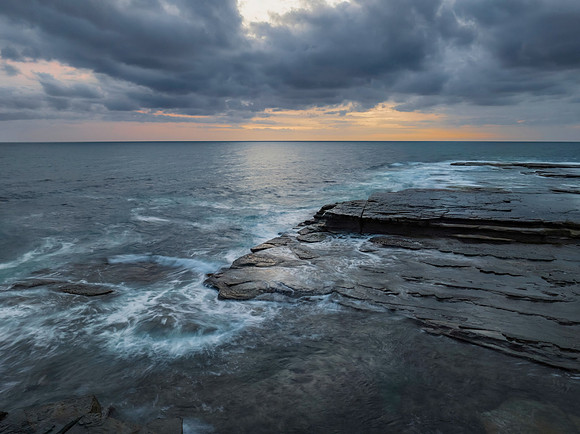 Sunrise over the sea and rocky Inlet