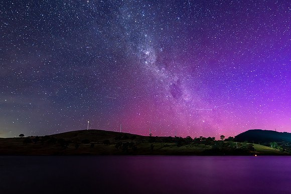 A Pink Aurora Australis and the Milky Way Shimmers Over the Dam