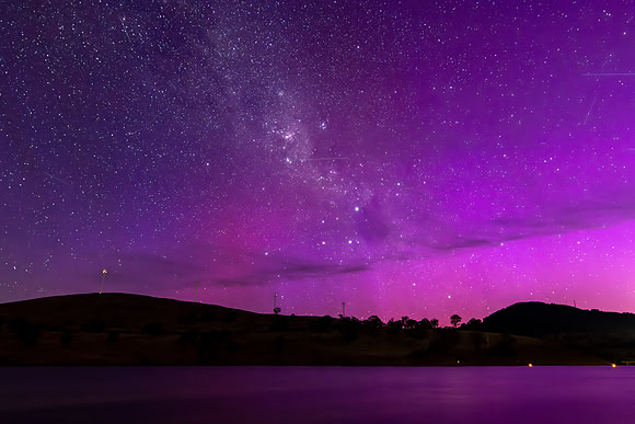 A Pink Aurora Australis and the Milky Way Shimmers Over the Dam