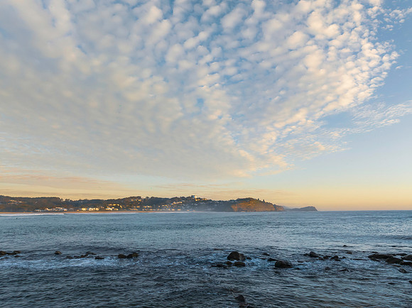 Sunrise over the ocean with rocks