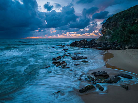 Rain clouds and sunrise at the beach