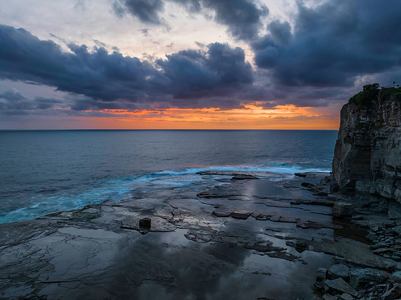 Sunrise over the sea and rocky Inlet