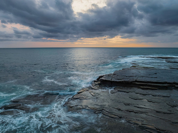 Sunrise over the sea and rocky Inlet