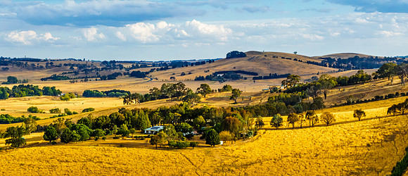 Cloud‑Laced Skies at Golden Hour Over Farmland