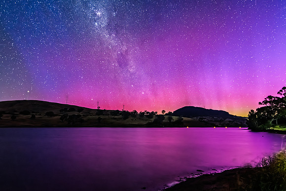 A Pink Aurora Australis and the Milky Way Shimmers Over the Dam