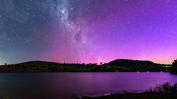A Pink Aurora Australis and the Milky Way Shimmers Over the Dam