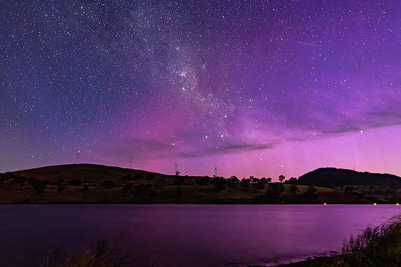 A Pink Aurora Australis and the Milky Way Shimmers Over the Dam