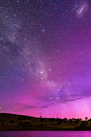 A Pink Aurora Australis and the Milky Way Shimmers Over the Dam