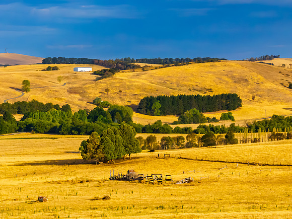 Cloud‑Laced Skies at Golden Hour Over Farmland