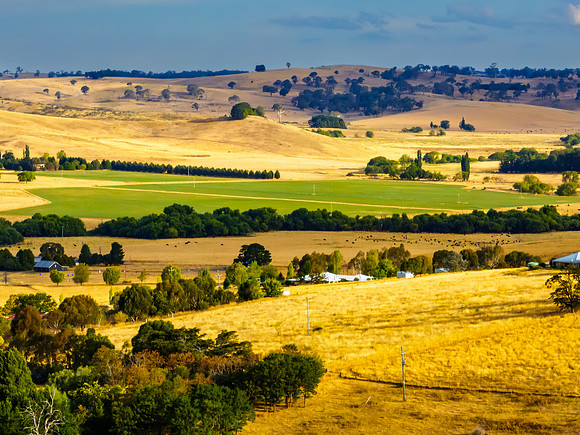 Cloud‑Laced Skies at Golden Hour Over Farmland