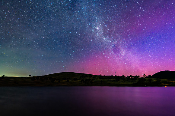 A Pink Aurora Australis and the Milky Way Shimmers Over the Dam