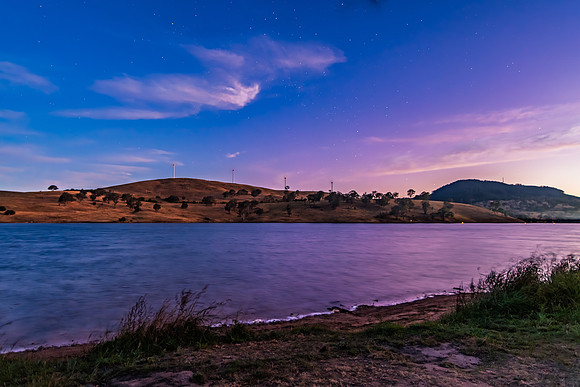 Twilight Deepens as Night Falls Over the Dam