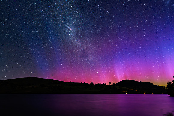 A Pink Aurora Australis and the Milky Way Shimmers Over the Dam