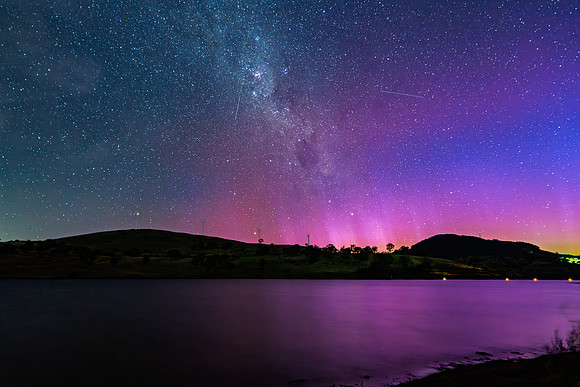 A Pink Aurora Australis and the Milky Way Shimmers Over the Dam