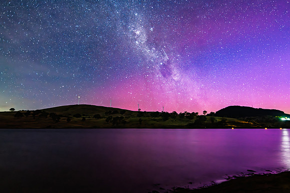 A Pink Aurora Australis and the Milky Way Shimmers Over the Dam