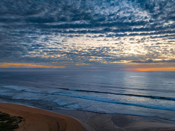 Beautiful sunrise with clouds over the ocean