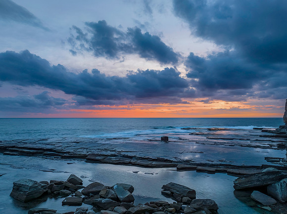 Sunrise over the sea and rocky Inlet