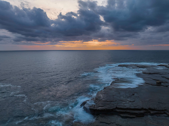 Sunrise over the sea and rocky Inlet