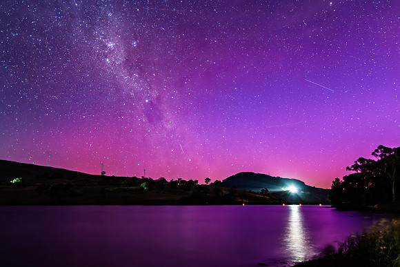A Pink Aurora Australis and the Milky Way Shimmers Over the Dam