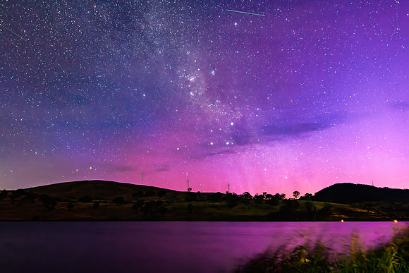 A Pink Aurora Australis and the Milky Way Shimmers Over the Dam