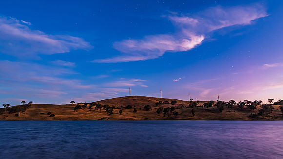 Twilight Deepens as Night Falls Over the Dam