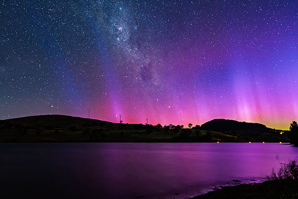 A Pink Aurora Australis and the Milky Way Shimmers Over the Dam