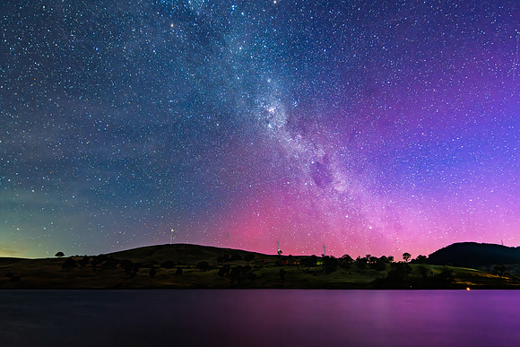 A Pink Aurora Australis and the Milky Way Shimmers Over the Dam