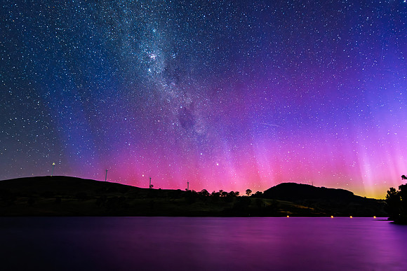 A Pink Aurora Australis and the Milky Way Shimmers Over the Dam