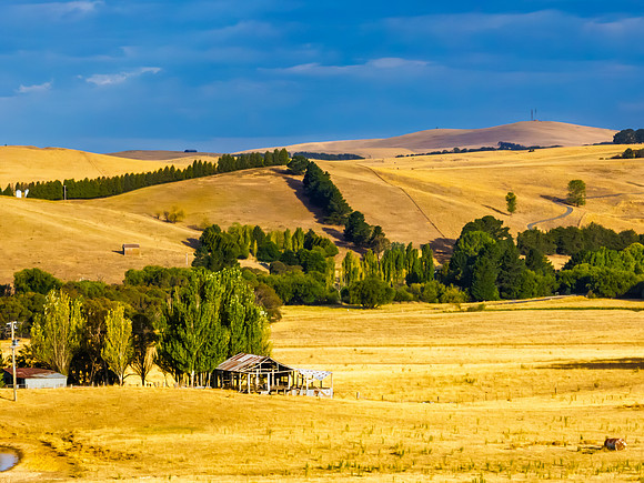 Cloud‑Laced Skies at Golden Hour Over Farmland