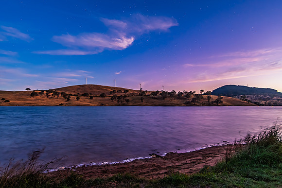 Twilight Deepens as Night Falls Over the Dam