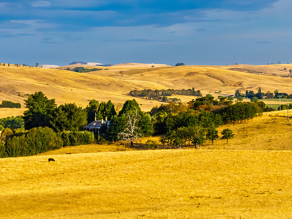 Cloud‑Laced Skies at Golden Hour Over Farmland