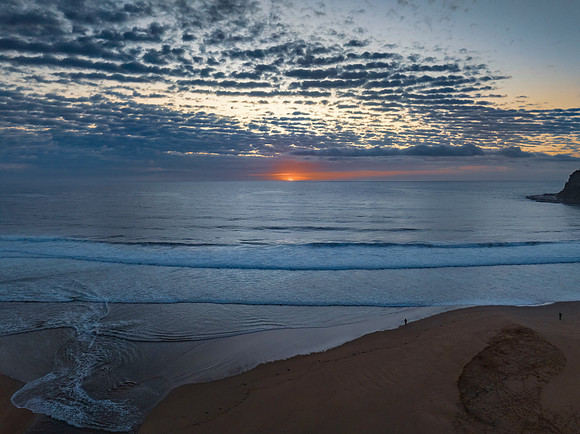 Beautiful sunrise with clouds over the ocean