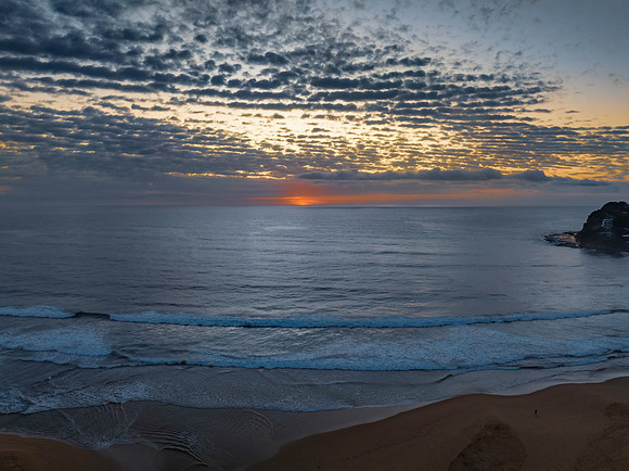 Beautiful sunrise with clouds over the ocean