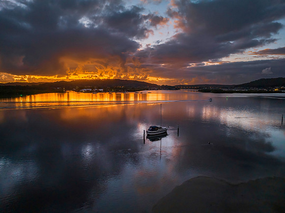 Dawn over the bay with clouds and orange highlights