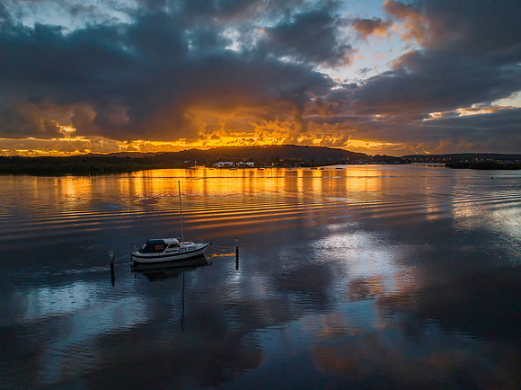Dawn over the bay with clouds and orange highlights