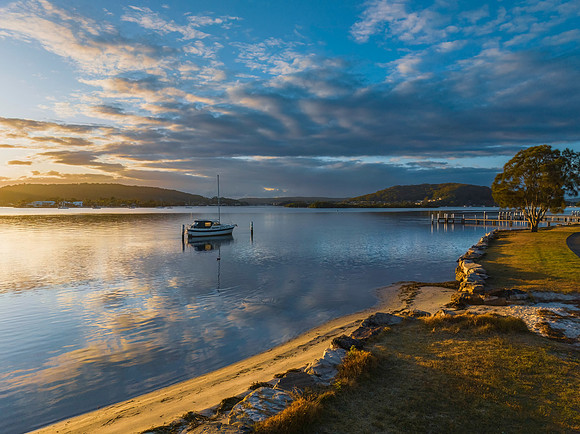Early morning light over the bay with clouds