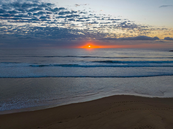 Beautiful sunrise with clouds over the ocean