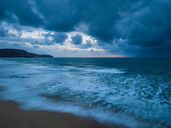 Rain clouds and sunrise at the beach