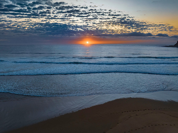 Beautiful sunrise with clouds over the ocean